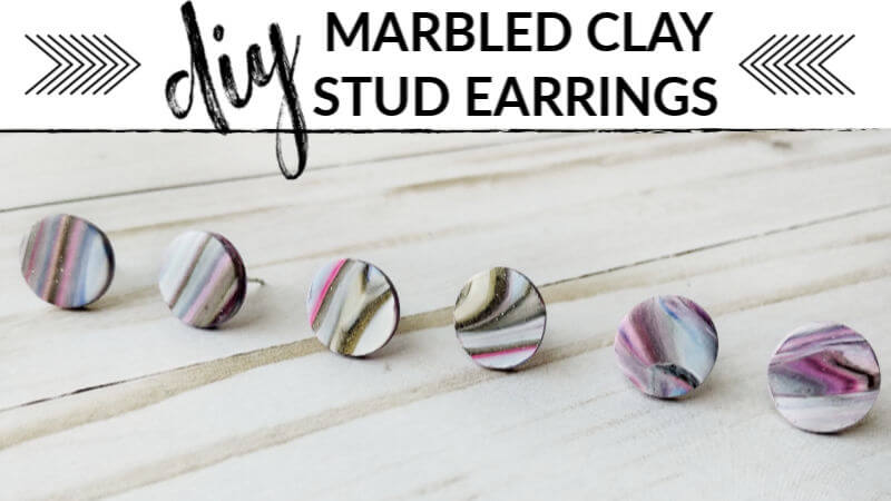 image of three pairs of marbled clay stud earrings with text overlay - diy marbled clay stud earrings